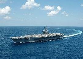The Nimitz-class aircraft carrier USS Dwight D. Eisenhower (CVN 69) conducts a turn in the Atlantic Ocean. Eisenhower is underway conducting routine carrier operations.