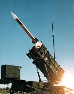 Four Patriot missiles like the one shown here can be fired from this mobile launcher between loadings.
