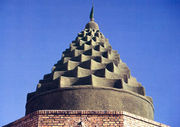 Domes like this are quite common in Khuzestan province. The shape is an architectural trademark of craftsmen of this province. Daniel's shrine, located in Khuzestan, has such a shape. The shrine pictured here, belongs to Imamzadeh Hamzeh, located between Mah-shahr and Hendijan.