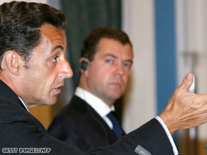 Nicolas Sarkozy, left, and Dmitry Medvedev outline the deal and the problems ahead.