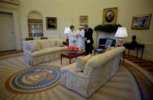 Pope Benedict XVI chats with U.S. President George W. Bush and first lady Laura Bush in the Oval Office at the White House in Washington