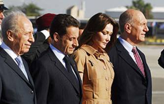 President Sarkozy, arriving on an official visit in honor of the 60th anniversary of Israel's independence, was welcomed by President Shimon Peres and PM Ehud Olmert.