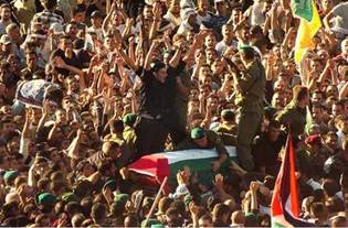 Reclaimed by his people ... Yasser Arafat's burial attracted 10,000 mourners to his grave site at his Ramallah compound.