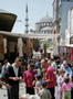 Istanbul residents, many of them new arrivals in this 10-million city which gets 200,000 migrants from the countryside  annually, crowd a street lined with street vendors in downtown Eminonu on May 19, 1996. The United Nations  conference on world's cities, Habitat II, will begin in Istanbul on June 3 to discuss problems of cities like Istanbul. More  than 20,000 people are expected to convene in Istanbul for the summit, adding to its chaos on the streets and traffic  jams. (AP Photo/Burhan Ozbilici)