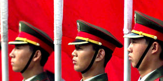 Chinese People?s Liberation Army soldiers form an honor guard in Beijing.