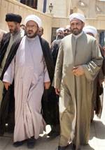 From left, Muqtada al-Sadr's aide Hazim al-Araji, Muqtada al-Sadr's aide Abdul-Hadi al-Daraji and Senior Sunni Cleric Abdul Salam al-Kubaisi leave a meeting between the two religious groups at Baghdad's Sunni Um al-Qura mosque in Iraq Sunday. (AP/Karim Kadim)